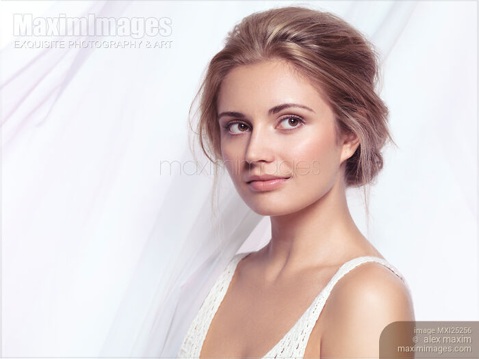 Stock photo of Young pretty woman closeup face portrait Buy commercial use license at MaximImages