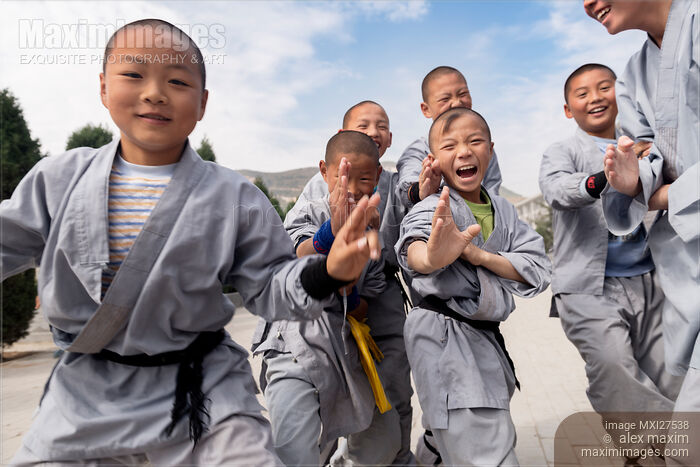 Stock photo of Young Shaolin Kung Fu students having fun in DengFeng China Buy commercial use license at MaximImages