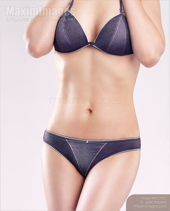 Young slim woman in blue underwear Stock photo of Young slim woman in blue underwear Buy commercial use license at MaximImages