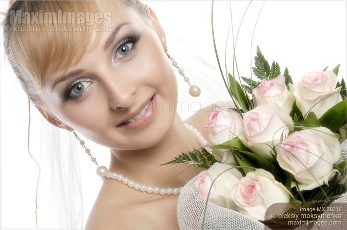 Stock photo of Young Smiling Woman with Bunch of White Roses Buy commercial use license at MaximImages