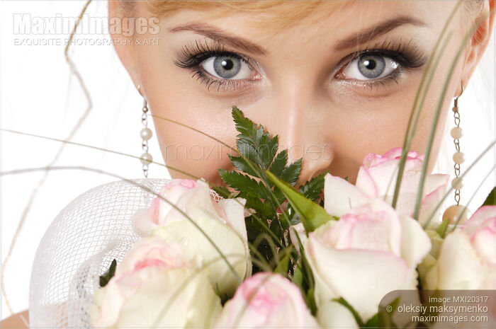 Stock photo of Young Smiling Woman with Bunch of White Roses Buy commercial use license at MaximImages