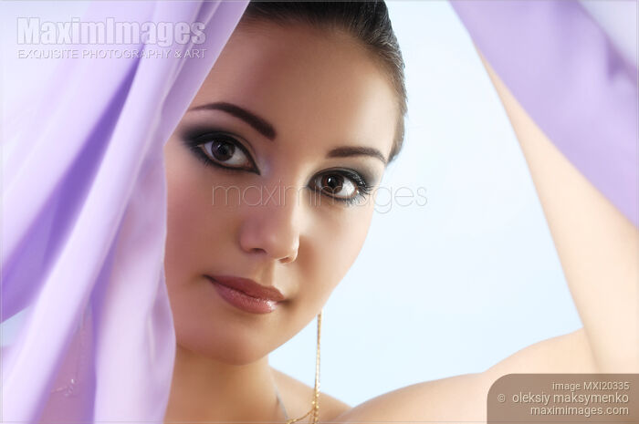 Young woman face behind curtain Stock photo of Young woman face behind curtain Buy commercial use license at MaximImages