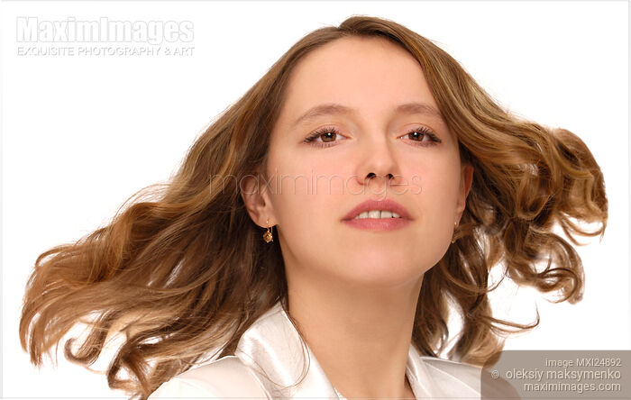 Young woman face with long flying hair Stock photo of Young woman face with long flying hair Buy commercial use license at MaximImages