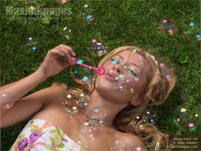 Young Woman Having Fun in Summer Stock photo of Young Woman Having Fun in Summer Buy commercial use license at MaximImages