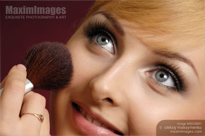 Young Woman Having Make-up Applied Stock photo of Young Woman Having Make-up Applied Buy commercial use license at MaximImages