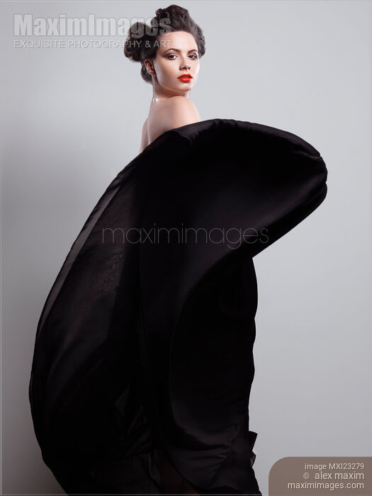 Young Woman in Black Dress Stock photo of Young Woman in Black Dress Buy commercial use license at MaximImages