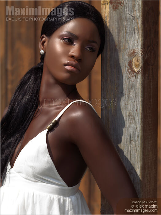 Stock photo of Young Woman in White Dress Buy commercial use license at MaximImages