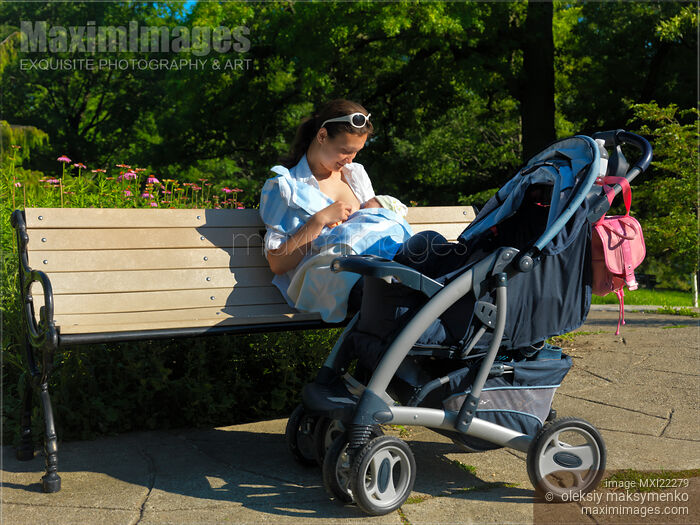 Stock photo of Young Woman Nursing Her Baby Outdoors Buy commercial use license at MaximImages