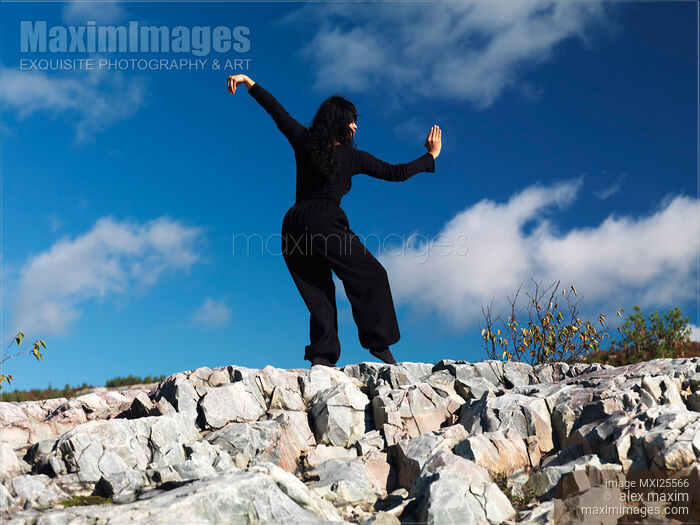 Stock photo of Young woman practicing Kung Fu in the nature Buy commercial use license at MaximImages