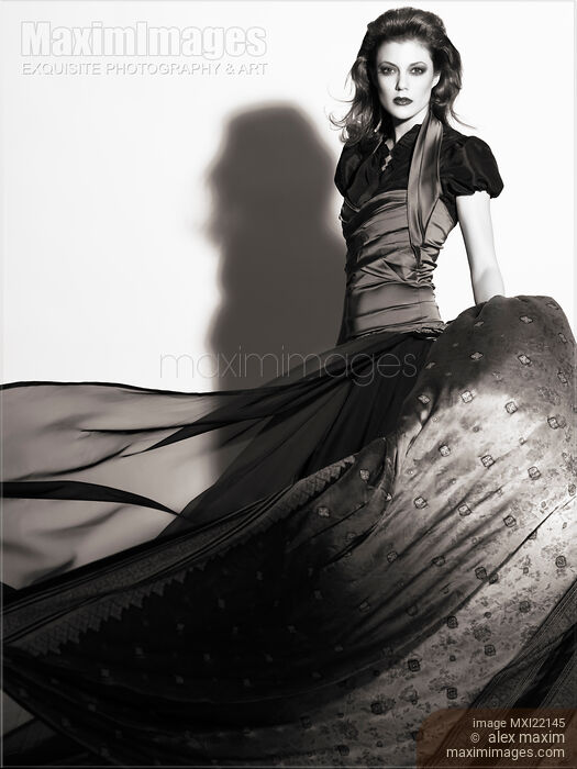 Young Woman Wearing a Long Flying Dress Stock photo of Young Woman Wearing a Long Flying Dress Buy commercial use license at MaximImages