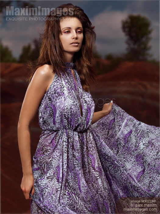 Young Woman Wearing Long Flare Dress Stock photo of Young Woman Wearing Long Flare Dress Buy commercial use license at MaximImages