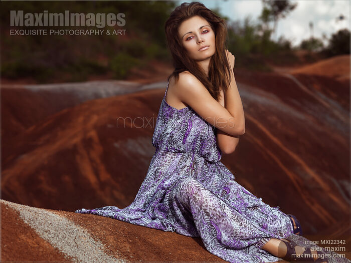 Young Woman Wearing Long Flare Dress Stock photo of Young Woman Wearing Long Flare Dress Buy commercial use license at MaximImages