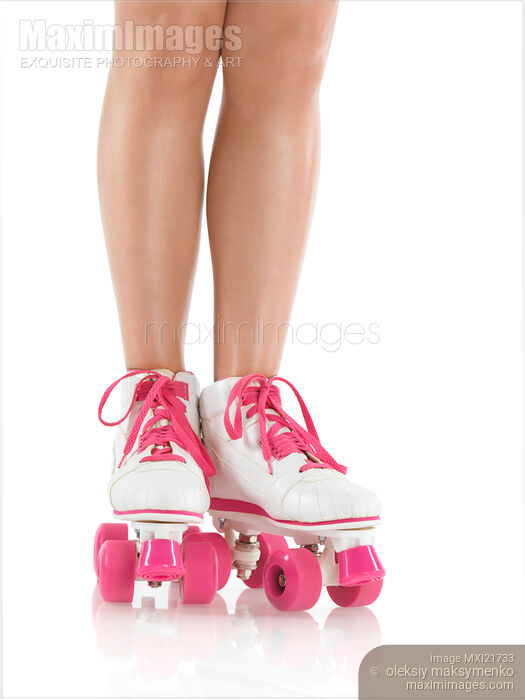 Stock photo of Young Woman Wearing Roller Derby Skates Buy commercial use license at MaximImages