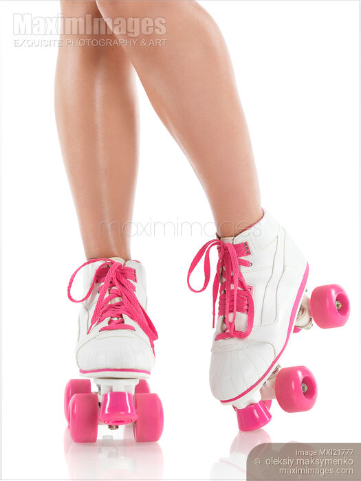 Stock photo of Young Woman Wearing Roller Derby Skates Buy commercial use license at MaximImages