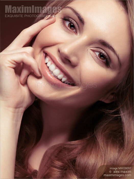 Stock photo of Young woman with a natural smile Buy commercial use license at MaximImages