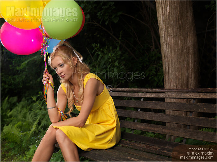 Stock photo of Young Woman with Air Balloons Buy commercial use license at MaximImages