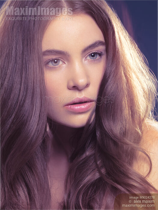 Stock photo of Young woman with long light brown hair Buy commercial use license at MaximImages