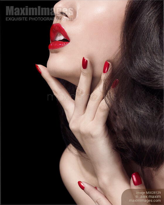 Young woman with red lipstick sensual closeup of mouth Stock photo of Young woman with red lipstick sensual closeup of mouth Buy commercial use license at MaximImages