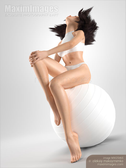 Stock image of Young woman with slim sit body on fitness ball Buy commercial use license at MaximImages