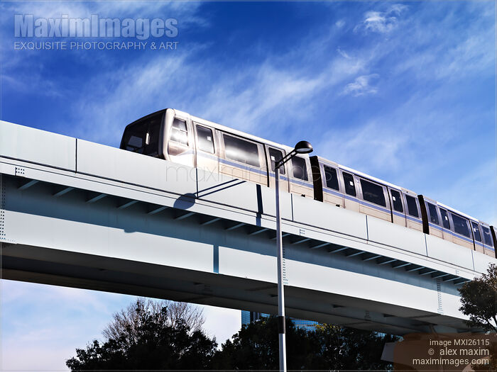 Yurikamome line train on elevated railway going through Odaiba Tokyo Stock photo of Yurikamome line train on elevated railway going through Odaiba Tokyo Buy commercial use license at MaximImages