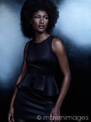 same-quail770: a black woman wearing a shiny navy blue dress with