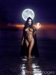 Limited edition print: Seductive mysterious snake-like woman in white face mask with sensual nude body walking out of the water like a goddess in full moon MaximImages.com