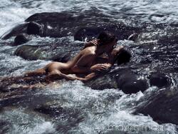 Limited edition print: Sensual romantic nude couple in an embrace, kissing, making love in wild water of a river in nature scenery MaximImages.com